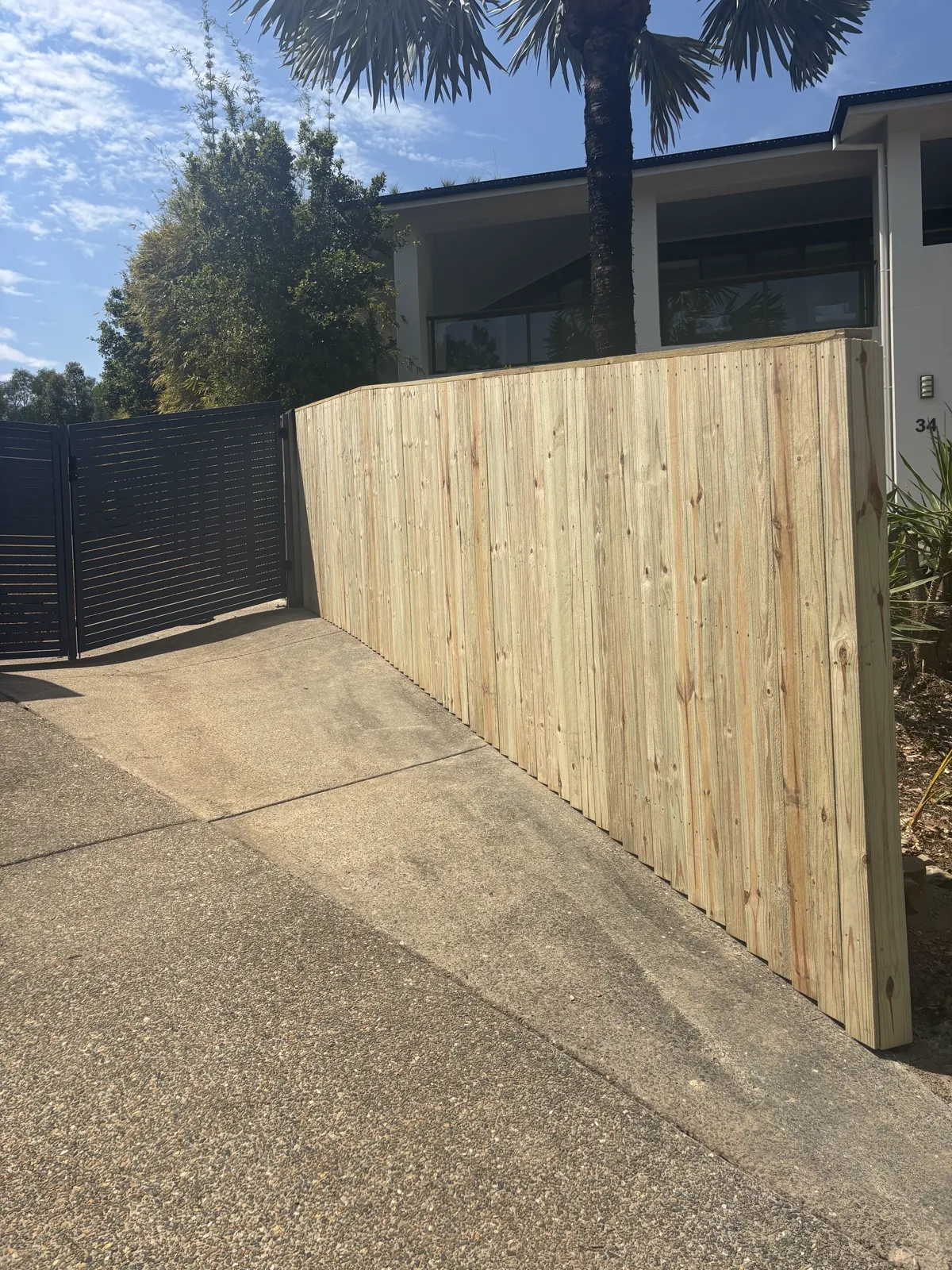Treated pine fence with timber capping rail paling style butted, Mudgeeraba